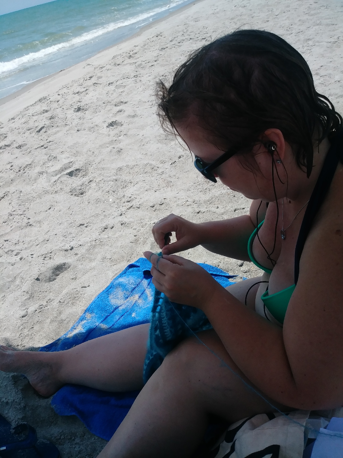 Chris  Crocheting at the beach